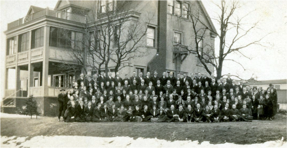 Students and Faculty in Front the Alliance Training Home