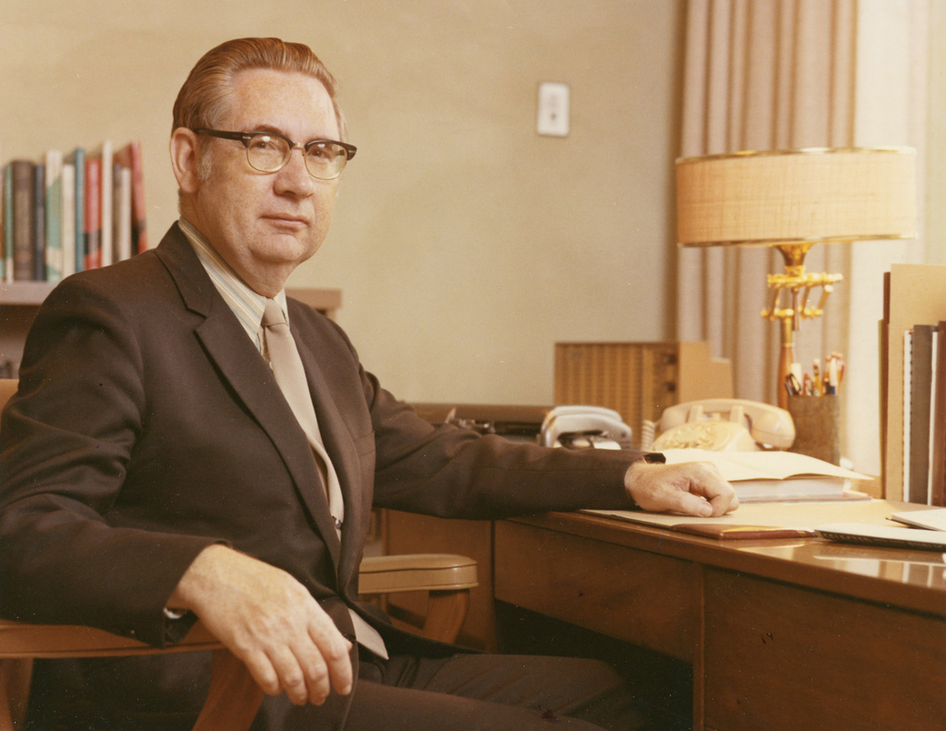 Doctor Donald Trouten Sitting at Desk